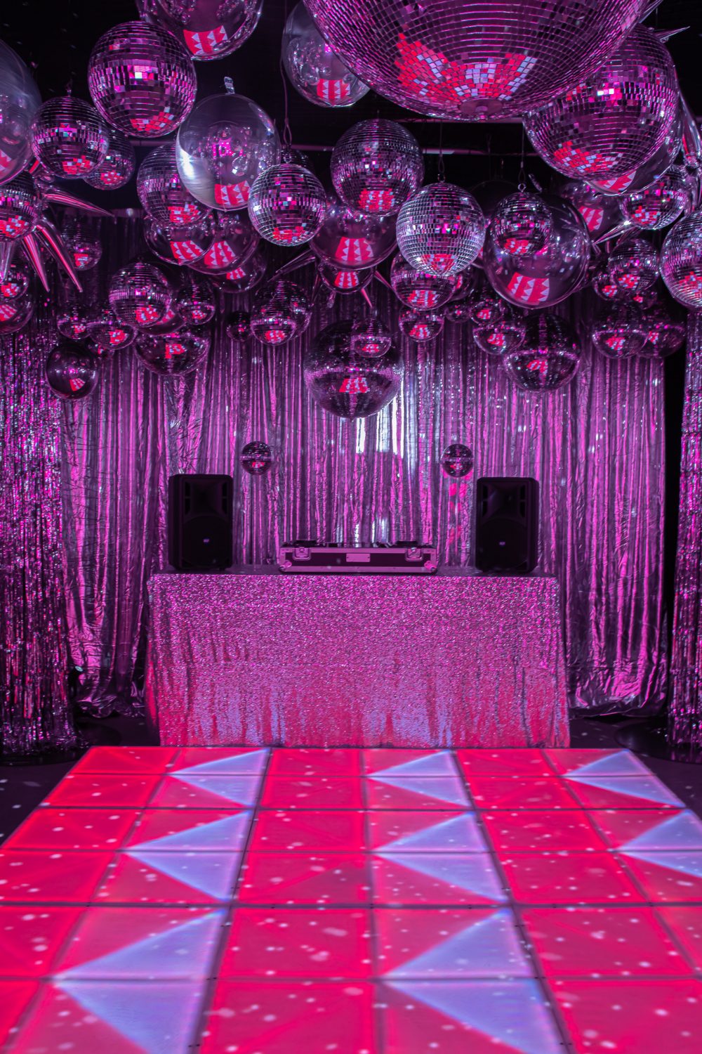 70s silver disco theme led dance floor, dj booth, and silver mirror balls