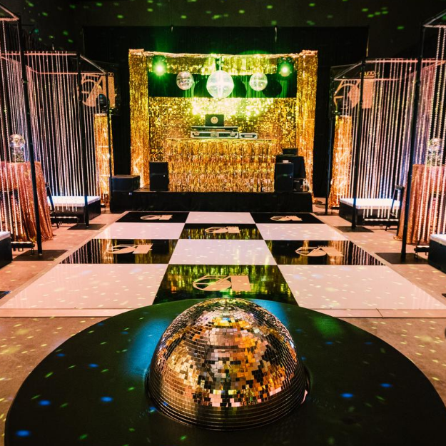 empty warehouse decorated and transformed into a studio 54 theme