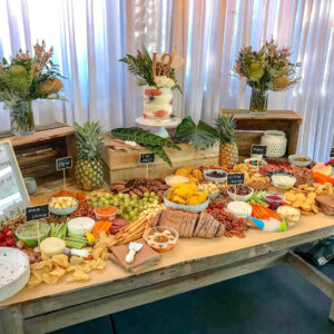 Rustic and tropical grazing table white drape backdrop hire melbourne