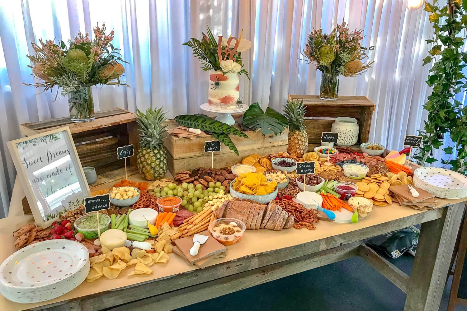 Rustic and tropical grazing table white drape backdrop hire melbourne