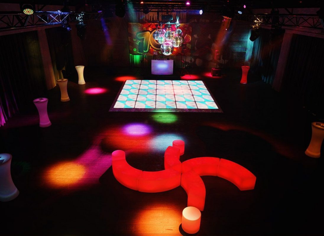 70s themed party setup led dance floor and furniture