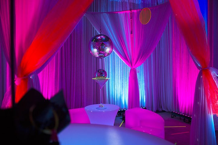 80s themed event draping, illuminated furniture and mirror balls