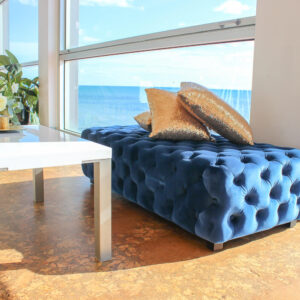 Side View of Blue Velvet Ottoman Hire Melbounre with Gold Pillows