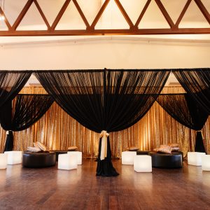 1920s theme lounge area chiffon draping and ottomans