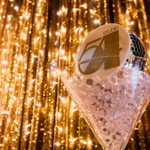 themed table props and decor at a studio 54 themed party