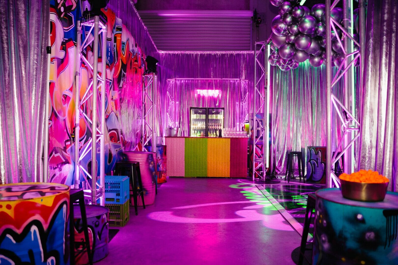 Graffiti themed party, themed backdrops, bar area, graffiti drums