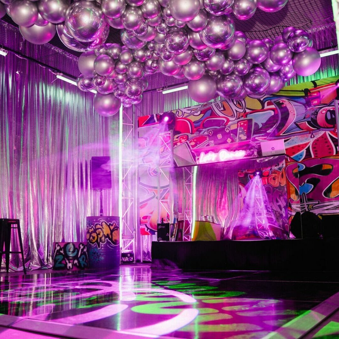 graffiti themed party dance floor area and party lights