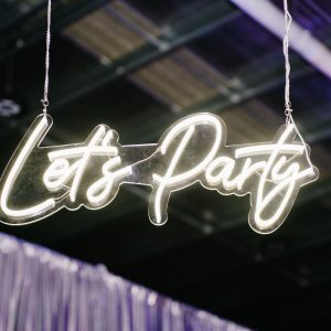 Let's party neon sign at graffiti themed party