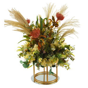 Floral centrepiece with gold stand, greenery, florals, and feathers