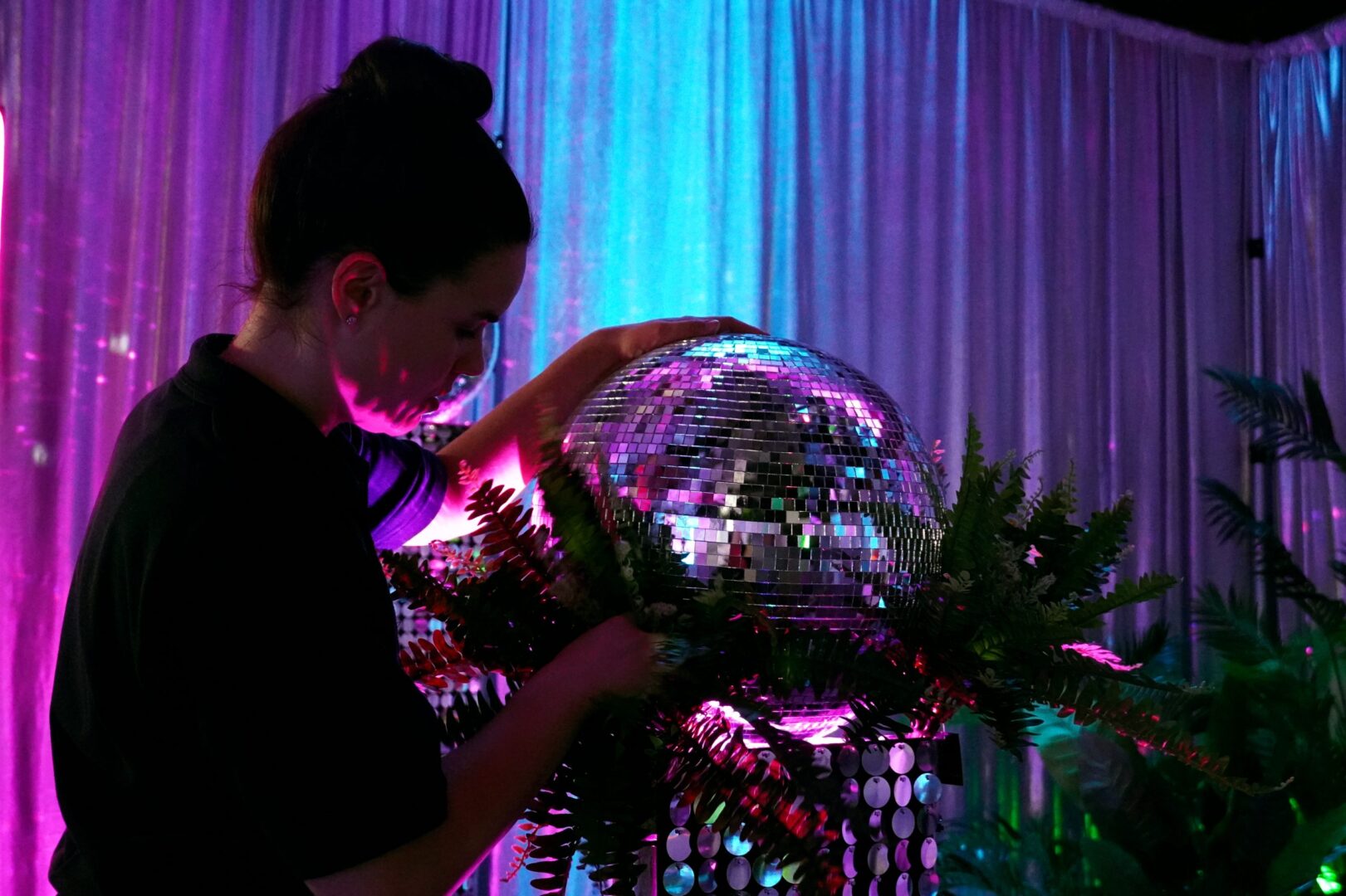staff - emma setting up mirror balls