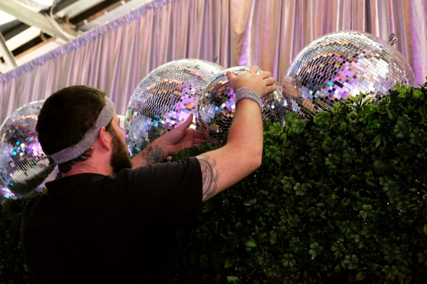 Staff Photo - Kane setting up mirror balls