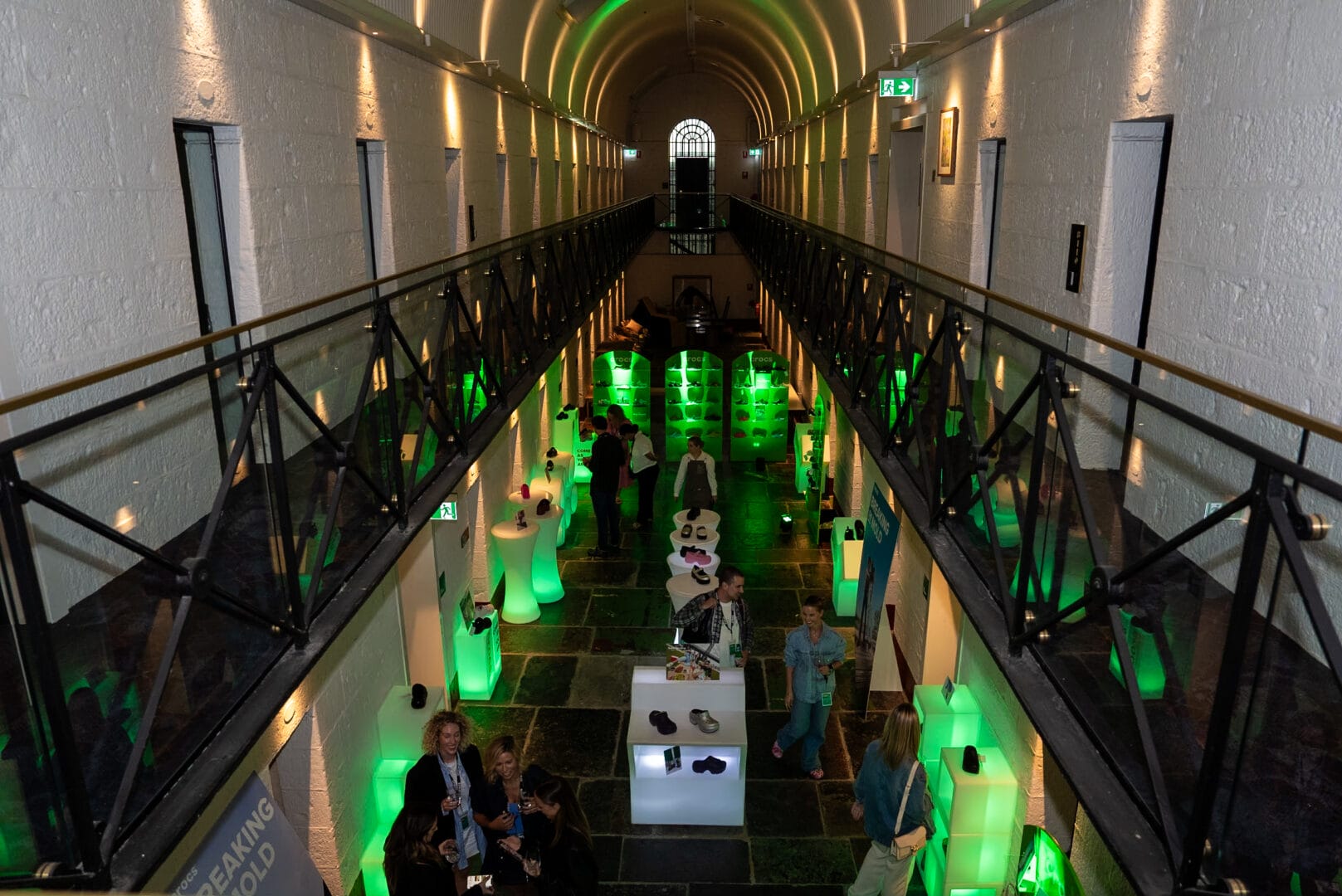 Crocs 2023 Trade Show - overhead shot of venue featuring illuminated furniture and crocs products