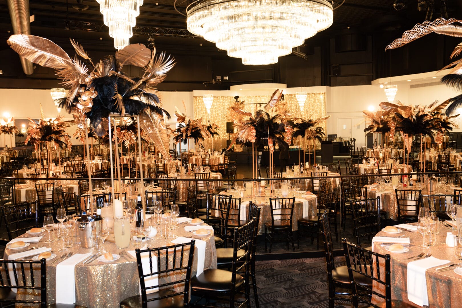 black and gold floral centrepieces at 1920s themed end of year gala