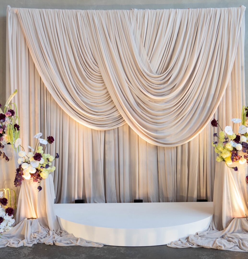 Beige scalloped drape - wedding backdrop - wedding decorating drape hire drape hire melbourne dramatic drape