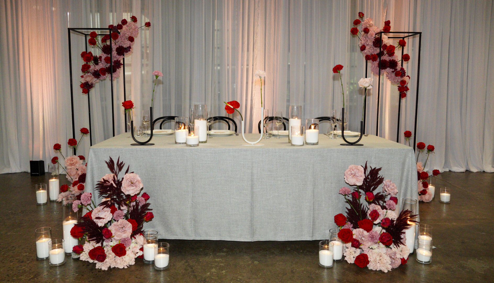 modern red and pink wedding setup bridal table wedding decorating trends for 2025