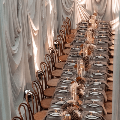 Mocha mousse styled event with dramatic draping and tablescape