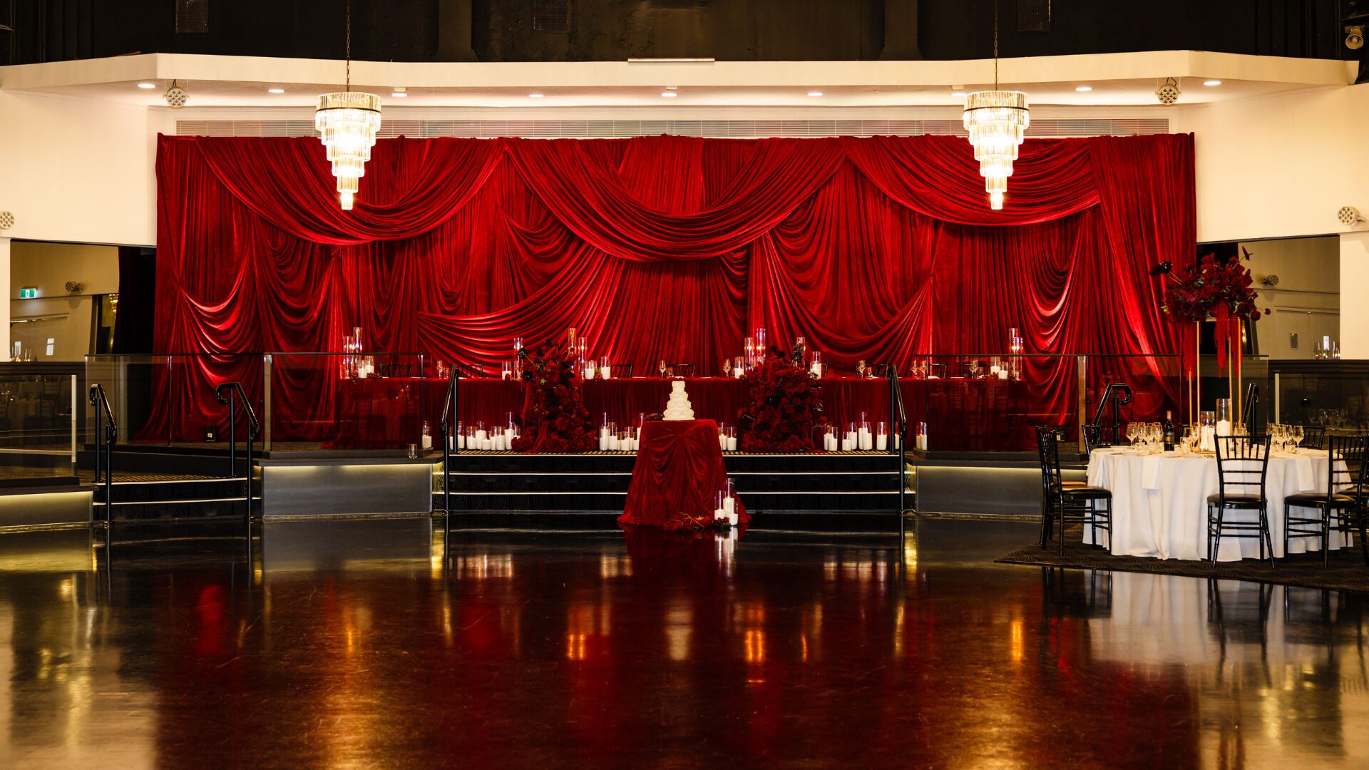 deep red styling, burgundy wedding styling, crimson florals, red wedding colour palette, reception styling, wedding centrepieces, red floral arrangements, draped wedding venue, elegant event styling, Melbourne event styling