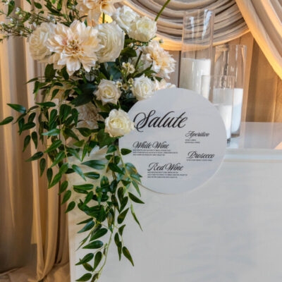 Classic romance wedding reception setup with beige scalloped drape, unconventional tables, lush greenery and florals why is choosing wedding decor so hard?