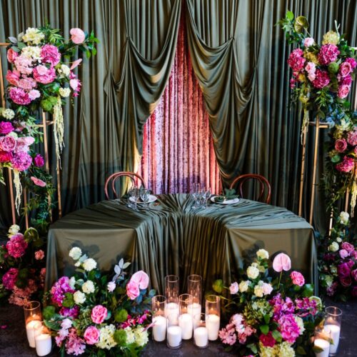 green draping wedding ceremony, wedding ceremony backdrop green drapes, greenery draped ceremony setup, elegant green fabric wedding styling, indoor wedding ceremony green draping, romantic green draped aisle backdrop, wedding ceremony styling with greenery and draping, soft green fabric ceremony decor, modern green draping wedding design, lush greenery ceremony backdrop styling